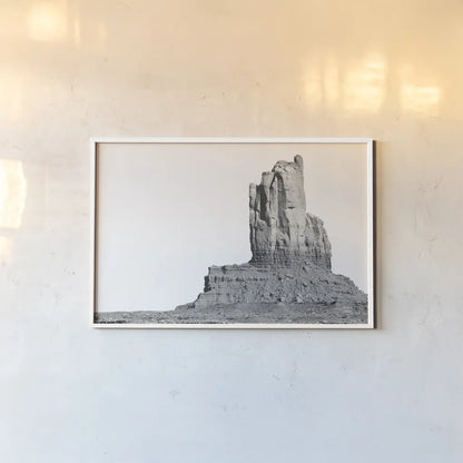 Monument Valley I by Nathan Larson. shown as a paper print in a white frame. Available as a archival giclee rolled canvas, fine art paper, or poster print. SKU 86708i.
