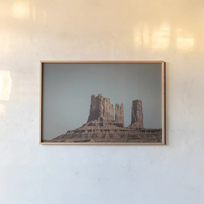 Monument Valley II by Nathan Larson. shown as a paper print in a natural frame. Available as a archival giclee rolled canvas, fine art paper, or poster print. SKU 86709i.