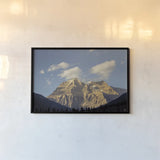 Mount Robson by Nathan Larson. shown as a paper print in a black flame. Available as a archival giclee rolled canvas, fine art paper, or poster print. SKU 104558i.