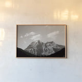Mount Robson BW by Nathan Larson. shown as a paper print in a natural frame. Available as a archival giclee rolled canvas, fine art paper, or poster print. SKU 104557i.