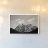 Mount Robson BW by Nathan Larson. shown as a paper print in a white frame. Available as a archival giclee rolled canvas, fine art paper, or poster print. SKU 104557i.
