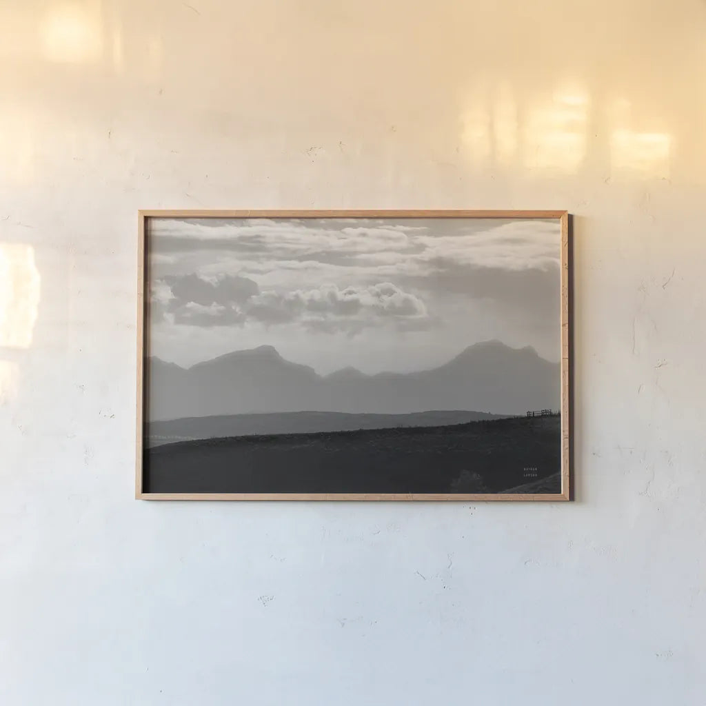 Mountain Layers by Nathan Larson. shown as a paper print in a natural frame. Available as a archival giclee rolled canvas, fine art paper, or poster print. SKU 81197i.