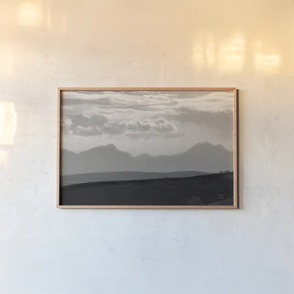 Mountain Layers by Nathan Larson. shown as a paper print in a natural frame. Available as a archival giclee rolled canvas, fine art paper, or poster print. SKU 81197i.