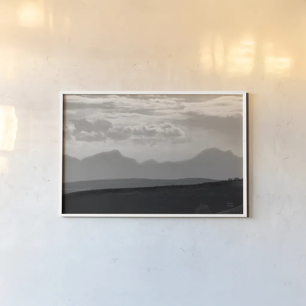 Mountain Layers by Nathan Larson. shown as a paper print in a white frame. Available as a archival giclee rolled canvas, fine art paper, or poster print. SKU 81197i.