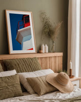 Musquash Head Lighthouse by Nathan Larson. shown as a paper print in a natural frame. Available as a archival giclee rolled canvas, fine art paper, or poster print. SKU 100497h.
