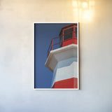 Musquash Head Lighthouse by Nathan Larson. shown as a paper print in a white frame. Available as a archival giclee rolled canvas, fine art paper, or poster print. SKU 100497h.