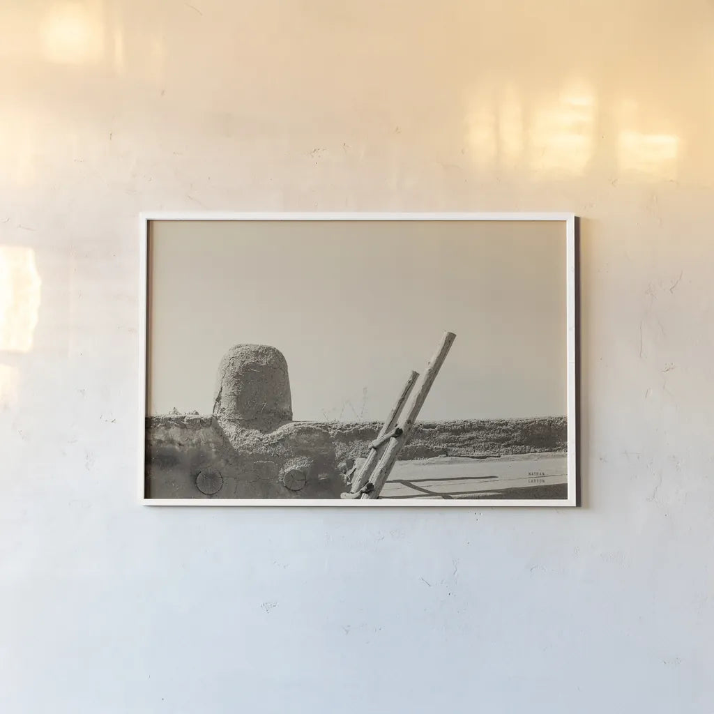 New Mexico Adobe by Nathan Larson. shown as a paper print in a white frame. Available as a archival giclee rolled canvas, fine art paper, or poster print. SKU 81818i.