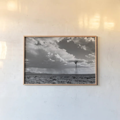 New Mexico Monsoon Rains by Nathan Larson. shown as a paper print in a natural frame. Available as a archival giclee rolled canvas, fine art paper, or poster print. SKU 82305i.