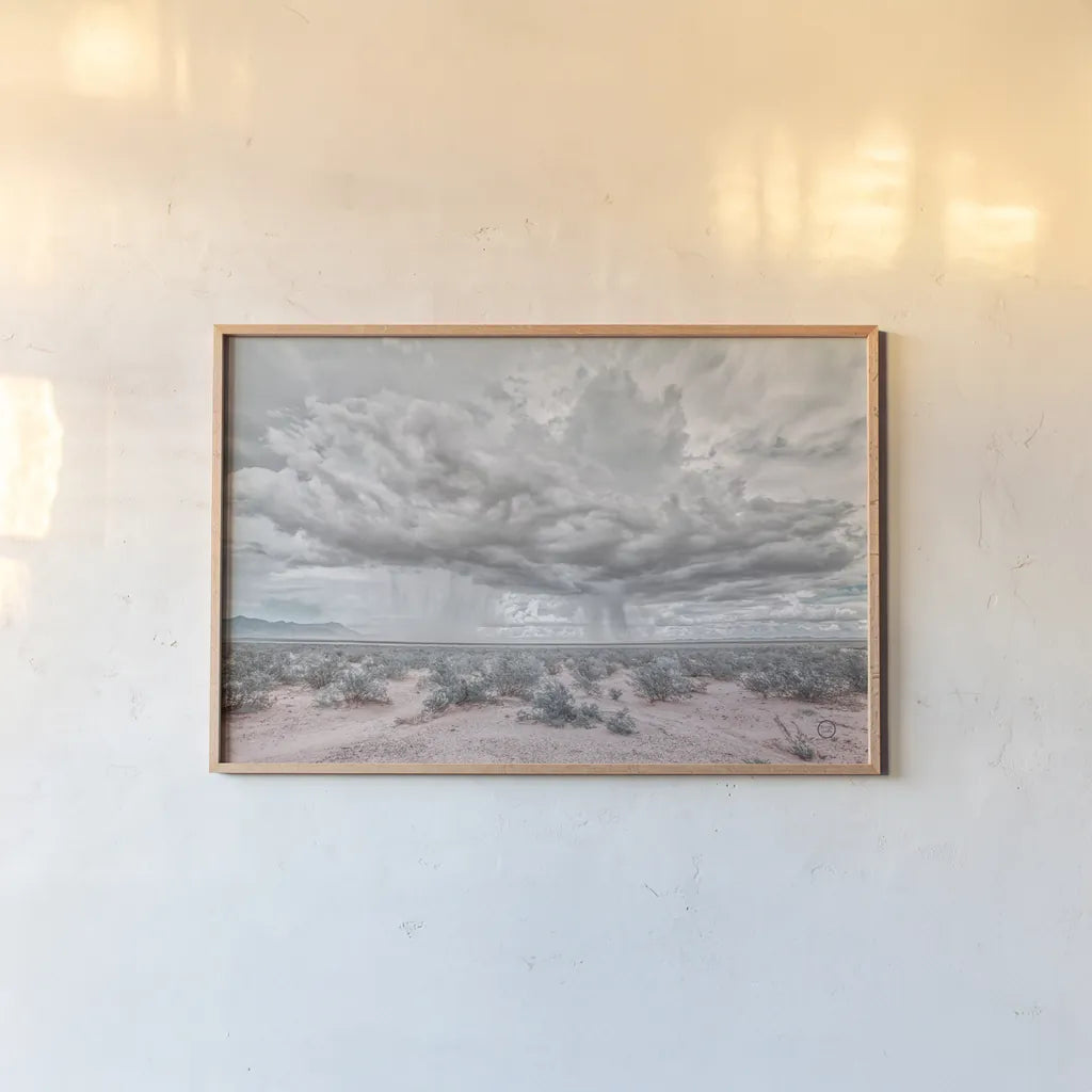 New Mexico Rain by Nathan Larson. shown as a paper print in a natural frame. Available as a archival giclee rolled canvas, fine art paper, or poster print. SKU 72033i.