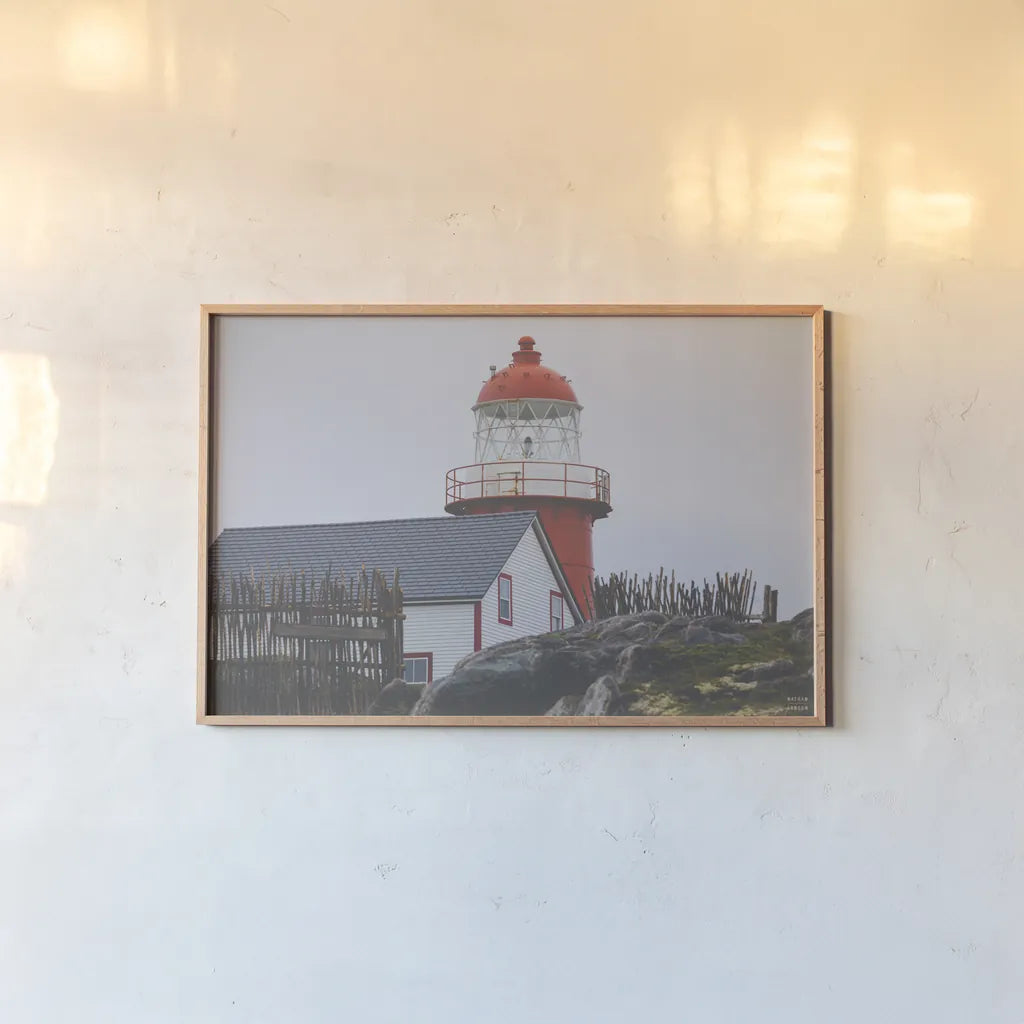 Newfoundland Foggy Morning by Nathan Larson. shown as a paper print in a natural frame. Available as a archival giclee rolled canvas, fine art paper, or poster print. SKU 100496i.