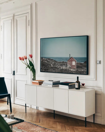 Newfoundland Historic Buildings Contrast by Nathan Larson. shown as a framed stretched canvas in a living room above a console. Available as a archival giclee rolled canvas, fine art paper, or poster print. SKU 101667i.