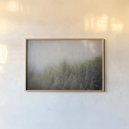 Northern Forests by Nathan Larson. shown as a paper print in a natural frame. Available as a archival giclee rolled canvas, fine art paper, or poster print. SKU 82412i.