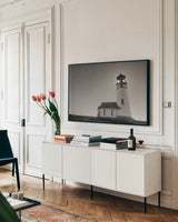 Oceanside Sunset by Nathan Larson. shown as a framed stretched canvas in a living room above a console. Available as a archival giclee rolled canvas, fine art paper, or poster print. SKU 90173i.