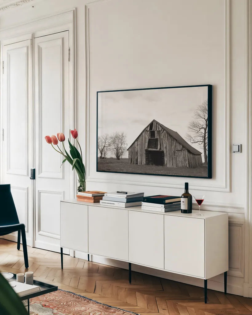 Old Hay Barn by Nathan Larson. shown as a framed stretched canvas in a living room above a console. Available as a archival giclee rolled canvas, fine art paper, or poster print. SKU 98023i.