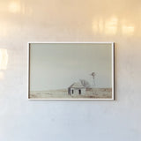 Old Well by Nathan Larson. shown as a paper print in a white frame. Available as a archival giclee rolled canvas, fine art paper, or poster print. SKU 98717i.