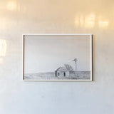 Old Well BW by Nathan Larson. shown as a paper print in a white frame. Available as a archival giclee rolled canvas, fine art paper, or poster print. SKU 98718i.