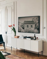 One Room Schoolhouse by Nathan Larson. shown as a framed stretched canvas in a living room above a console. Available as a archival giclee rolled canvas, fine art paper, or poster print. SKU 95335i.