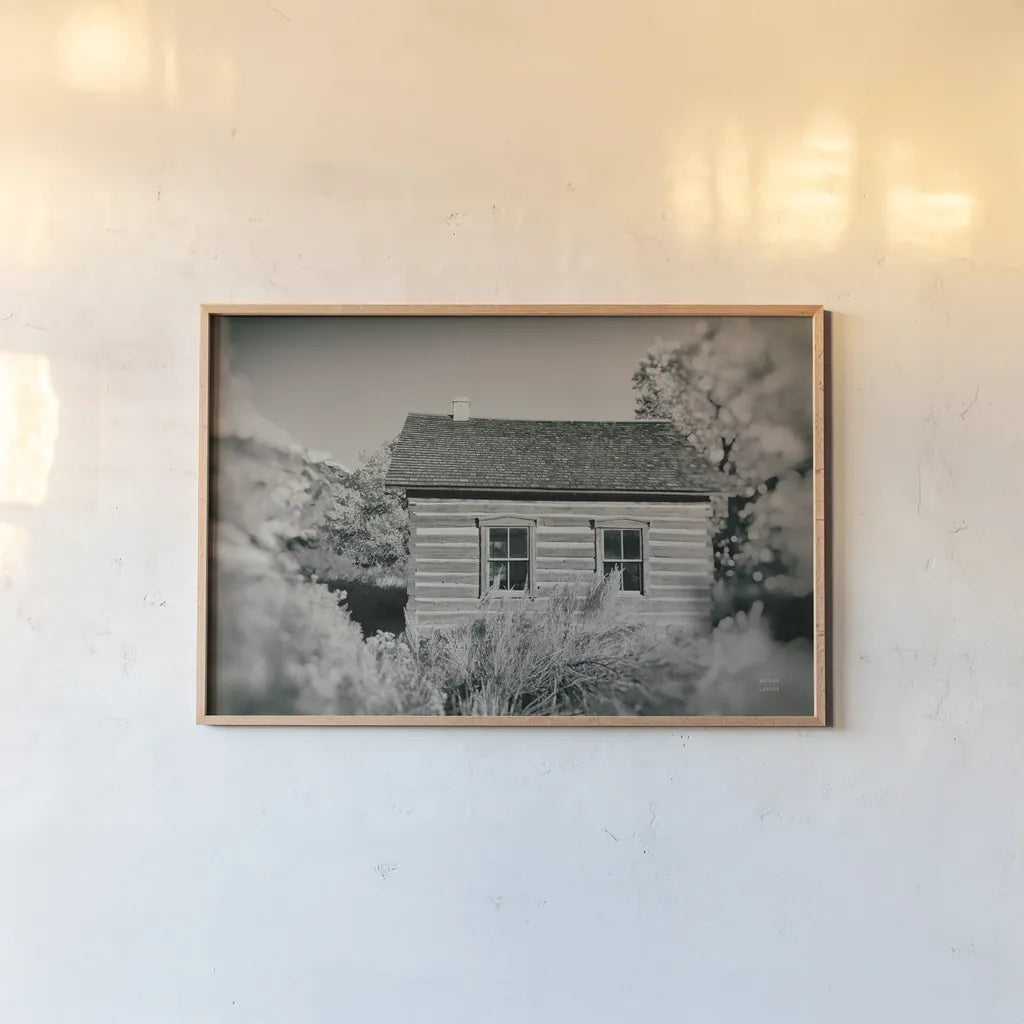 One Room Schoolhouse by Nathan Larson. shown as a paper print in a natural frame. Available as a archival giclee rolled canvas, fine art paper, or poster print. SKU 95335i.