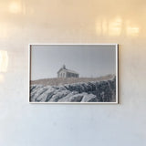 One Room Schoolhouse by Nathan Larson. shown as a paper print in a white frame. Available as a archival giclee rolled canvas, fine art paper, or poster print. SKU 98341i.