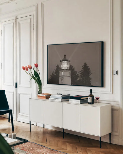 Oregon Coast Lighthouse by Nathan Larson. shown as a framed stretched canvas in a living room above a console. Available as a archival giclee rolled canvas, fine art paper, or poster print. SKU 90172i.