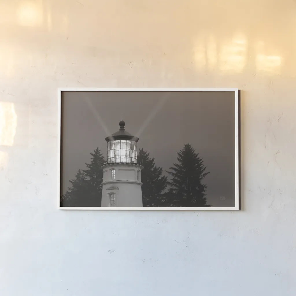 Oregon Coast Lighthouse by Nathan Larson. shown as a paper print in a white frame. Available as a archival giclee rolled canvas, fine art paper, or poster print. SKU 90172i.