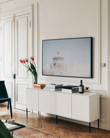Oregon Coast Lighthouse Color by Nathan Larson. shown as a framed stretched canvas in a living room above a console. Available as a archival giclee rolled canvas, fine art paper, or poster print. SKU 97442i.