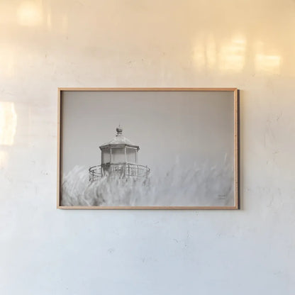 Oregon Coast Lighthouse Neutral by Nathan Larson. shown as a paper print in a natural frame. Available as a archival giclee rolled canvas, fine art paper, or poster print. SKU 86919i.
