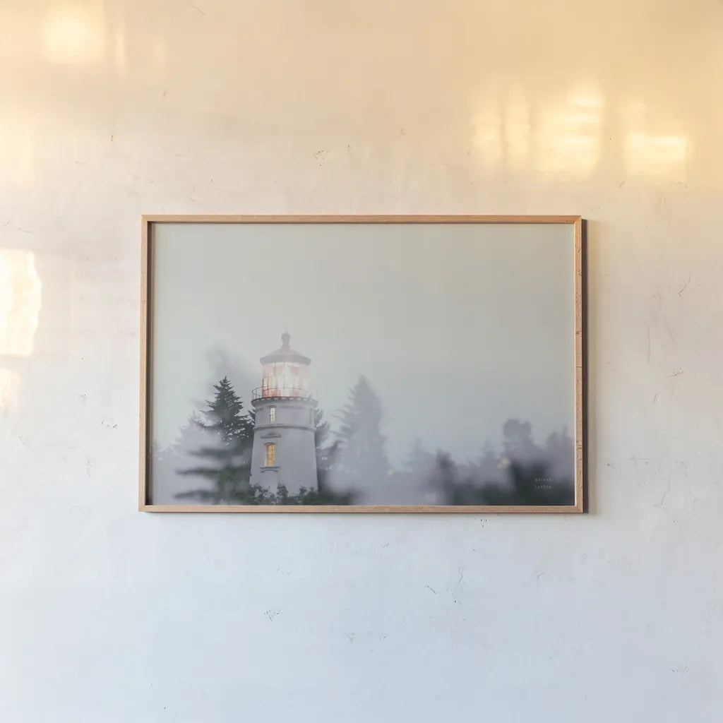 Oregon Coast Umpqua River Lighthouse by Nathan Larson. shown as a paper print in a natural frame. Available as a archival giclee rolled canvas, fine art paper, or poster print. SKU 87004i.