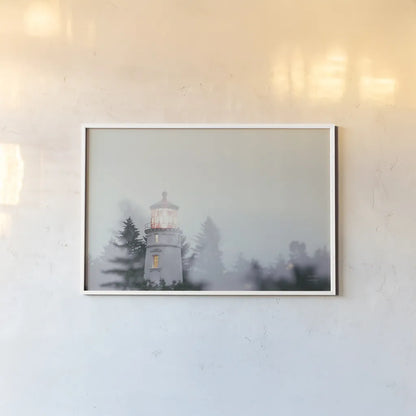 Oregon Coast Umpqua River Lighthouse by Nathan Larson. shown as a paper print in a white frame. Available as a archival giclee rolled canvas, fine art paper, or poster print. SKU 87004i.