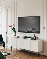 Orion BW by Nathan Larson. shown as a framed stretched canvas in a living room above a console. Available as a archival giclee rolled canvas, fine art paper, or poster print. SKU 84323i.