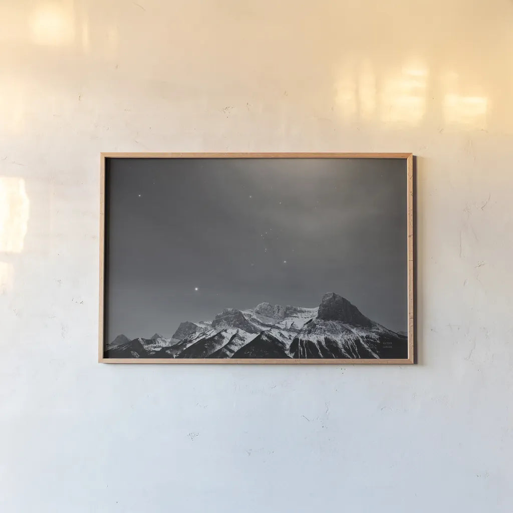 Orion BW by Nathan Larson. shown as a paper print in a natural frame. Available as a archival giclee rolled canvas, fine art paper, or poster print. SKU 84323i.