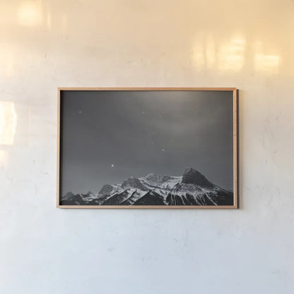 Orion BW by Nathan Larson. shown as a paper print in a natural frame. Available as a archival giclee rolled canvas, fine art paper, or poster print. SKU 84323i.