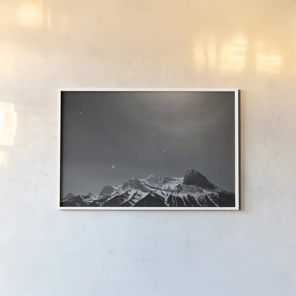 Orion BW by Nathan Larson. shown as a paper print in a white frame. Available as a archival giclee rolled canvas, fine art paper, or poster print. SKU 84323i.