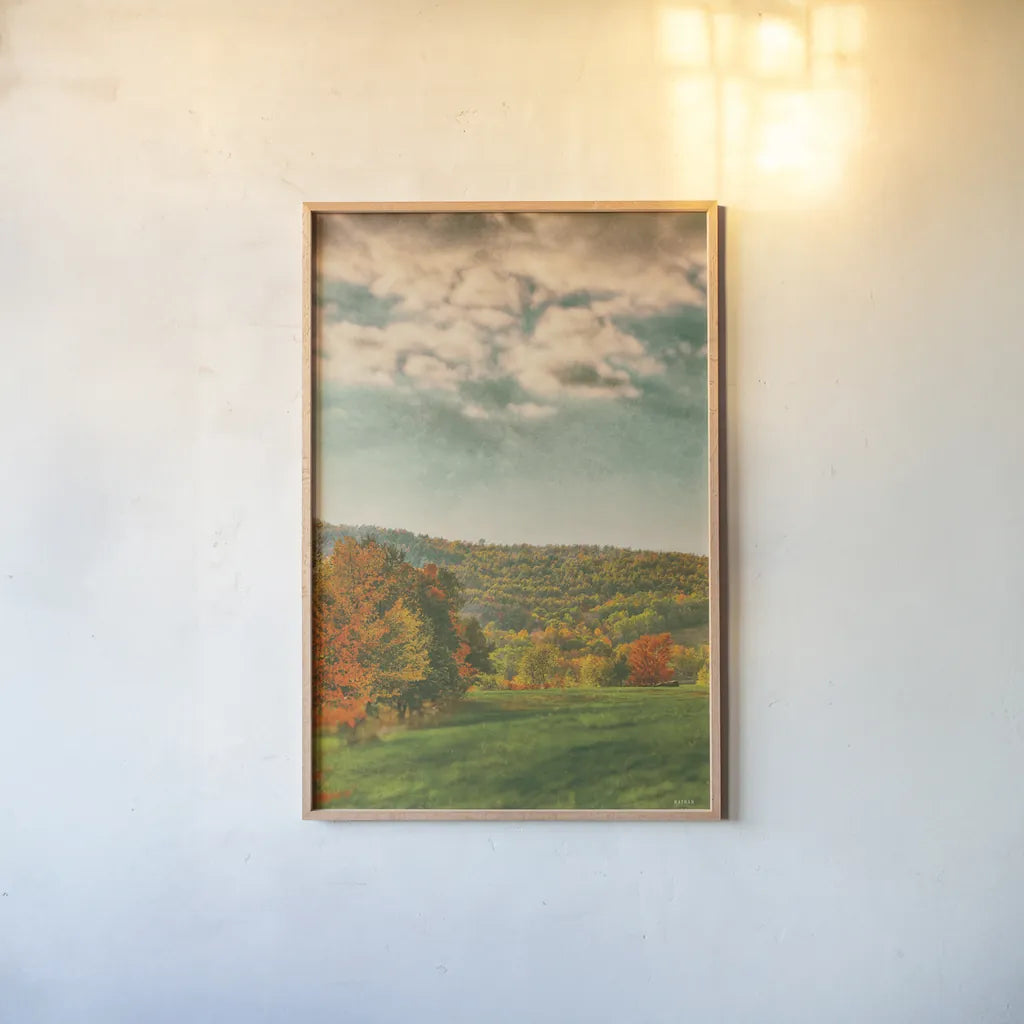 Over the Pasture by Nathan Larson. shown as a paper print in a natural frame. Available as a archival giclee rolled canvas, fine art paper, or poster print. SKU 101671h.
