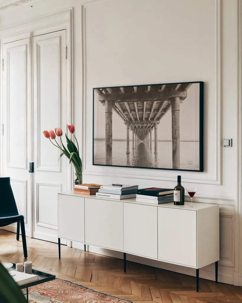Pacific Pier by Nathan Larson. shown as a framed stretched canvas in a living room above a console. Available as a archival giclee rolled canvas, fine art paper, or poster print. SKU 86918i.
