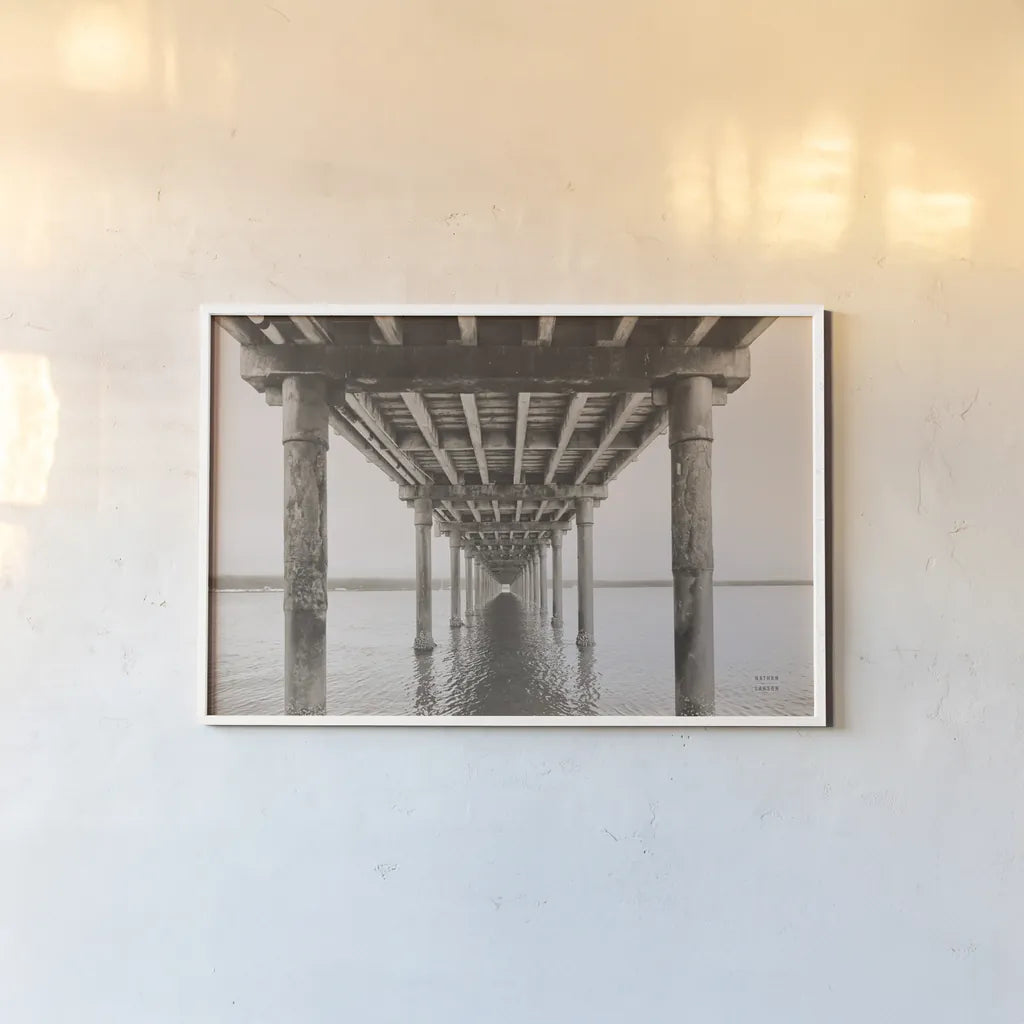 Pacific Pier by Nathan Larson. shown as a paper print in a white frame. Available as a archival giclee rolled canvas, fine art paper, or poster print. SKU 86918i.