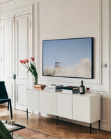 Peering Over by Nathan Larson. shown as a framed stretched canvas in a living room above a console. Available as a archival giclee rolled canvas, fine art paper, or poster print. SKU 87191i.