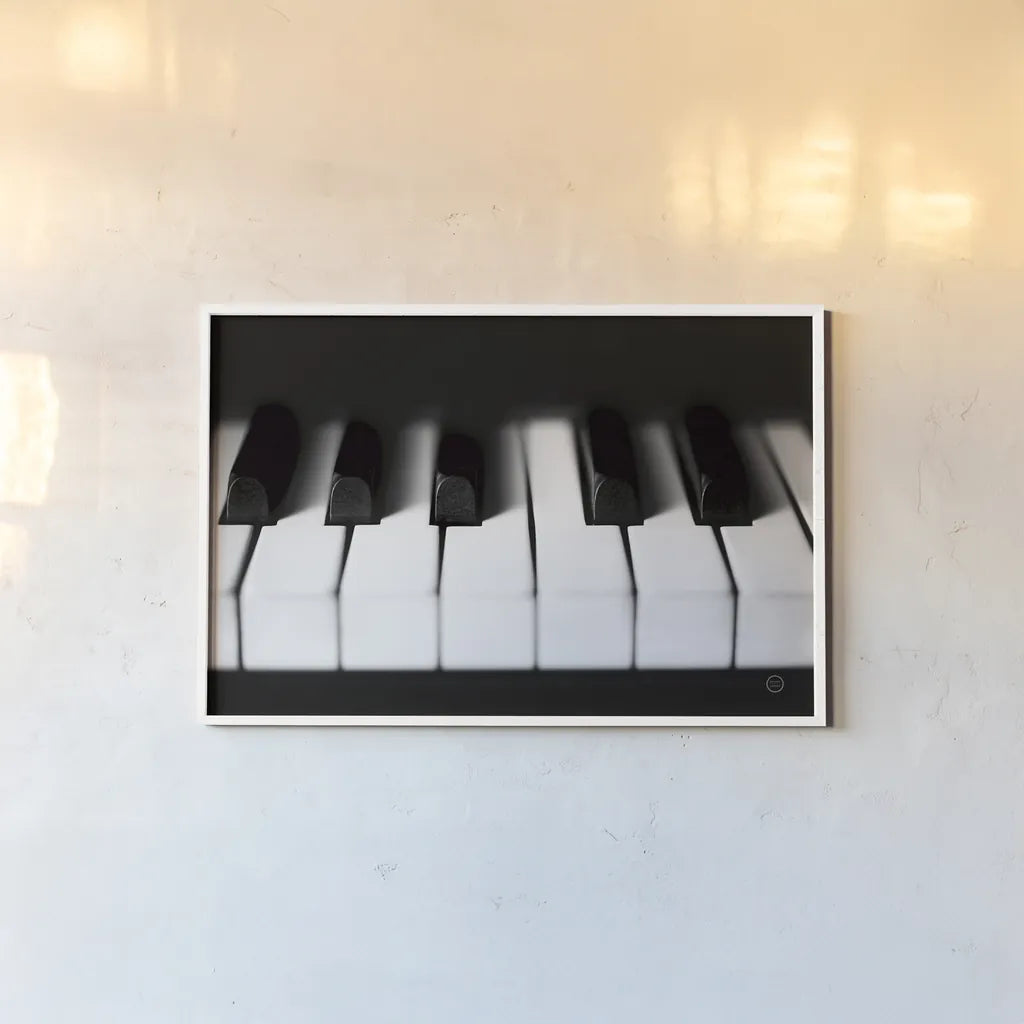 Piano Lounge I by Nathan Larson. shown as a paper print in a white frame. Available as a archival giclee rolled canvas, fine art paper, or poster print. SKU 76310i.