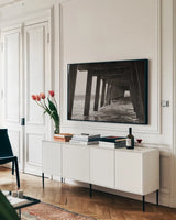 Pier Angles I by Nathan Larson. shown as a framed stretched canvas in a living room above a console. Available as a archival giclee rolled canvas, fine art paper, or poster print. SKU 97449i.