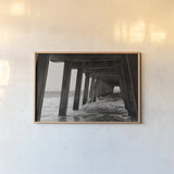 Pier Angles I by Nathan Larson. shown as a paper print in a natural frame. Available as a archival giclee rolled canvas, fine art paper, or poster print. SKU 97449i.