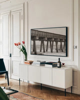 Pier Angles II by Nathan Larson. shown as a framed stretched canvas in a living room above a console. Available as a archival giclee rolled canvas, fine art paper, or poster print. SKU 97450i.