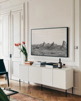 Pinnacle Sunset by Nathan Larson. shown as a framed stretched canvas in a living room above a console. Available as a archival giclee rolled canvas, fine art paper, or poster print. SKU 88886i.