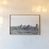Pinnacle Sunset by Nathan Larson. shown as a paper print in a natural frame. Available as a archival giclee rolled canvas, fine art paper, or poster print. SKU 88886i.