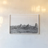 Pinnacle Sunset by Nathan Larson. shown as a paper print in a white frame. Available as a archival giclee rolled canvas, fine art paper, or poster print. SKU 88886i.