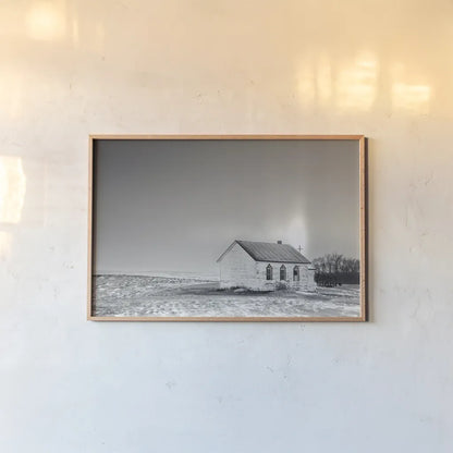 Prairie Church Solo Halo BW by Nathan Larson. shown as a paper print in a natural frame. Available as a archival giclee rolled canvas, fine art paper, or poster print. SKU 84240i.