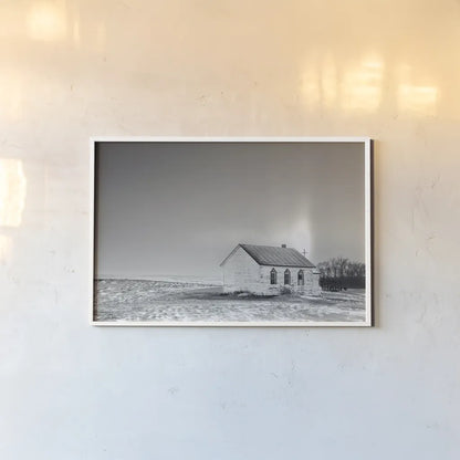 Prairie Church Solo Halo BW by Nathan Larson. shown as a paper print in a white frame. Available as a archival giclee rolled canvas, fine art paper, or poster print. SKU 84240i.