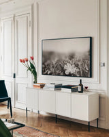 Prairie Nap by Nathan Larson. shown as a framed stretched canvas in a living room above a console. Available as a archival giclee rolled canvas, fine art paper, or poster print. SKU 103386i.