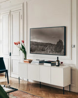 Rainbow Sunset Sepia by Nathan Larson. shown as a framed stretched canvas in a living room above a console. Available as a archival giclee rolled canvas, fine art paper, or poster print. SKU 86416i.