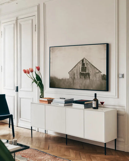 Rainy Barn Days by Nathan Larson. shown as a framed stretched canvas in a living room above a console. Available as a archival giclee rolled canvas, fine art paper, or poster print. SKU 98025i.