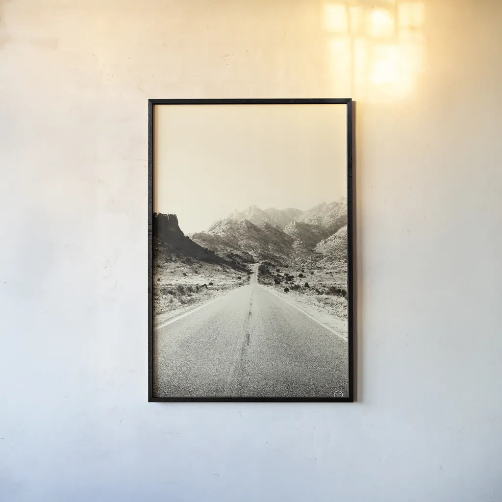 Road to Old West by Nathan Larson. shown as a paper print in a black flame. Available as a archival giclee rolled canvas, fine art paper, or poster print. SKU 72028h.